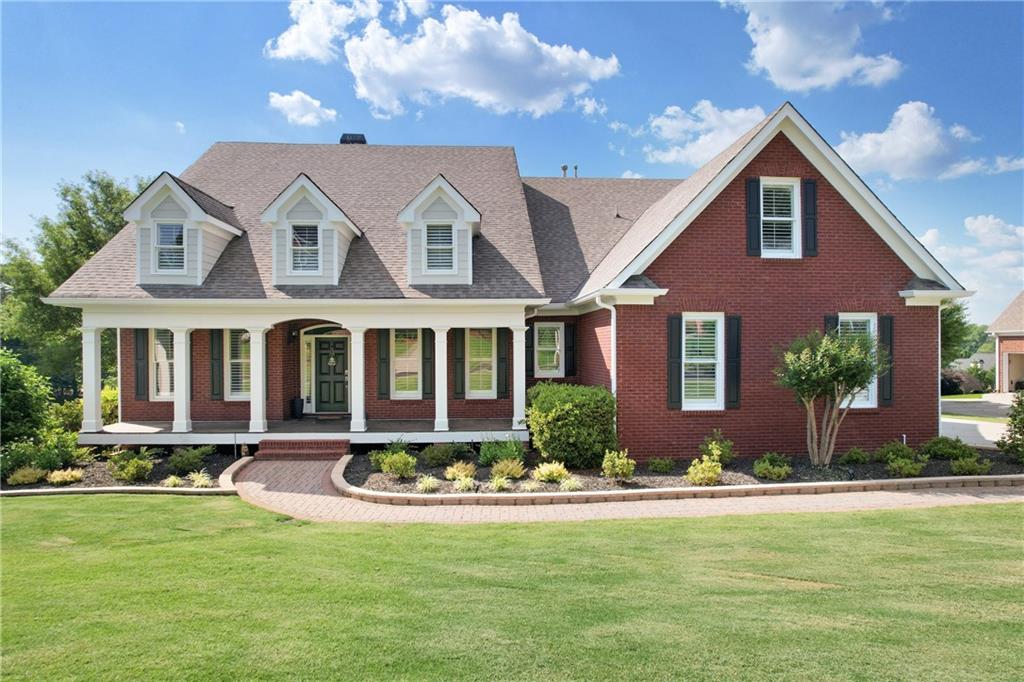 313 Reece Drive Hoschton, GA 30548 - Photo 1 of 1 a front view of a house with a yard fire pit and outdoor seating