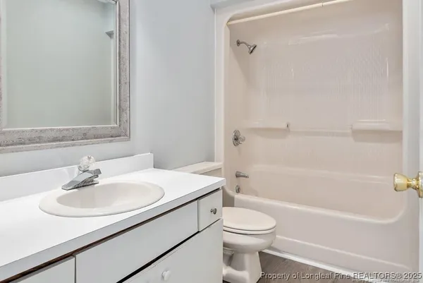 a bathroom with a sink toilet and a bathtub