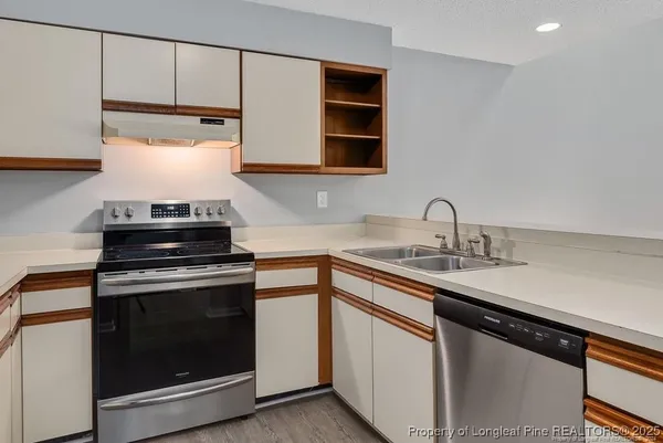 a kitchen with a stove and a sink