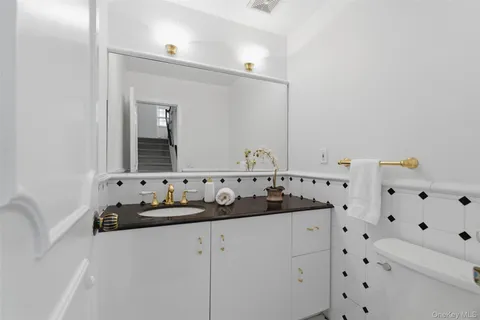 a bathroom with a double vanity sink mirror and