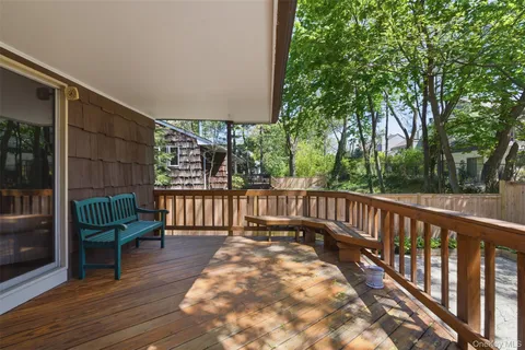 a view of balcony with furniture