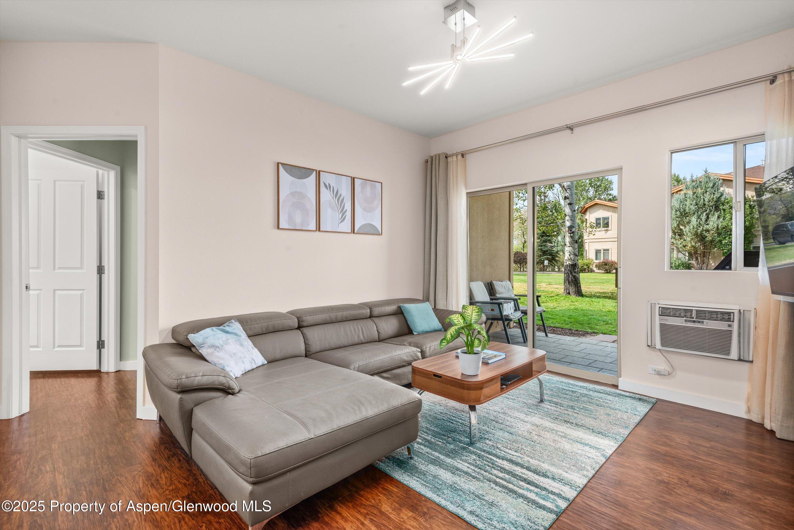 1400 East Valley Road, Unit 115 Basalt, CO 81621 - Photo 2 of 17 a living room with furniture and a fireplace
