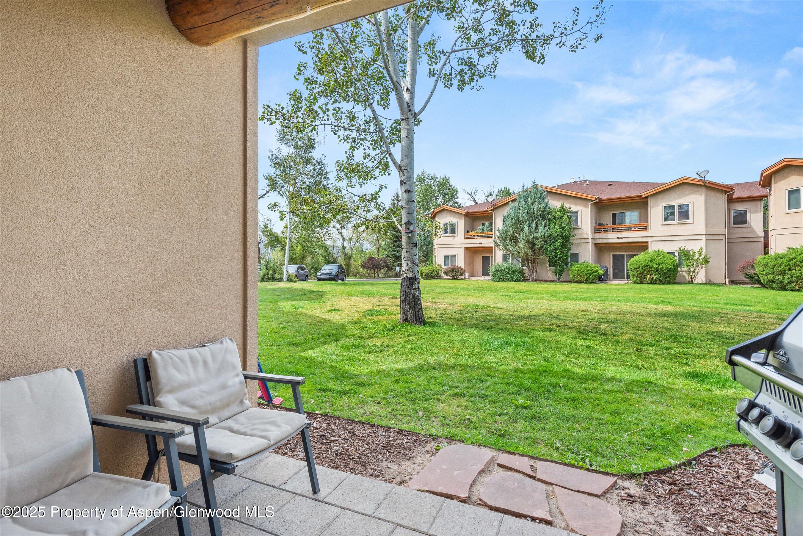 1400 East Valley Road, Unit 115 Basalt, CO 81621 - Photo 6 of 17 a view of a chairs in backyard of house