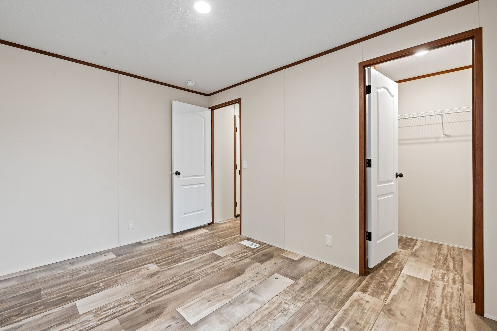 110 Van Sant Road, Unit 15 Kalispell, MT 59901 - Photo 17 of 22 Primary bedroom with walk-in closet