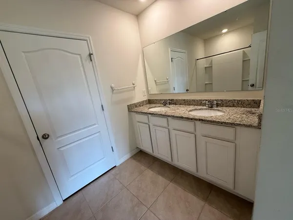 a bathroom with a shower and a bath tub