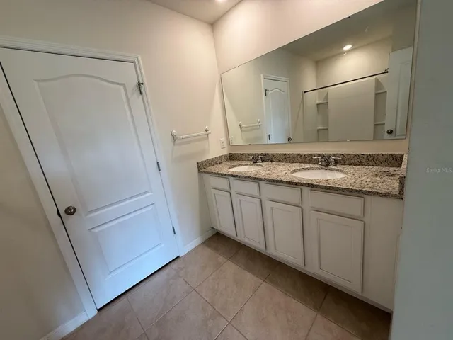 a bathroom with a shower and a bath tub