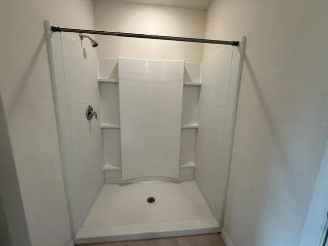 a view of room with racks on the wall