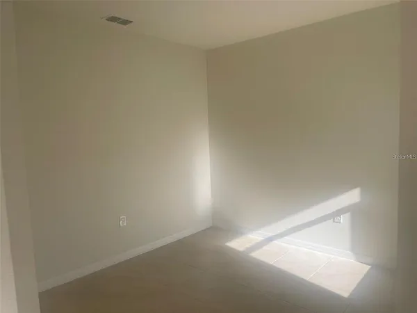 a kitchen with granite countertop a sink a stove and a granite counter top