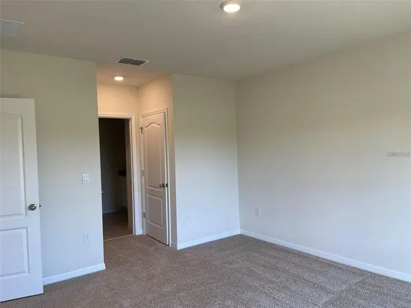a bathroom with a granite countertop toilet sink and bathtub