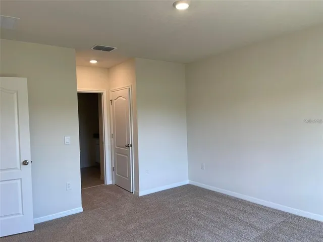 a bathroom with a granite countertop toilet sink and bathtub
