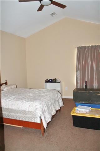 Master bedroom with vaulted ceilings and two closets