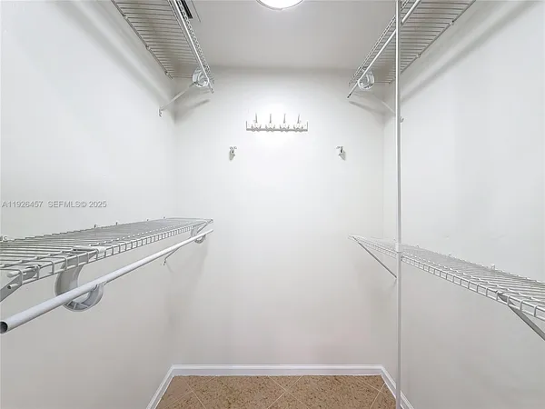 a view of a storage & utility room with racks on the wall