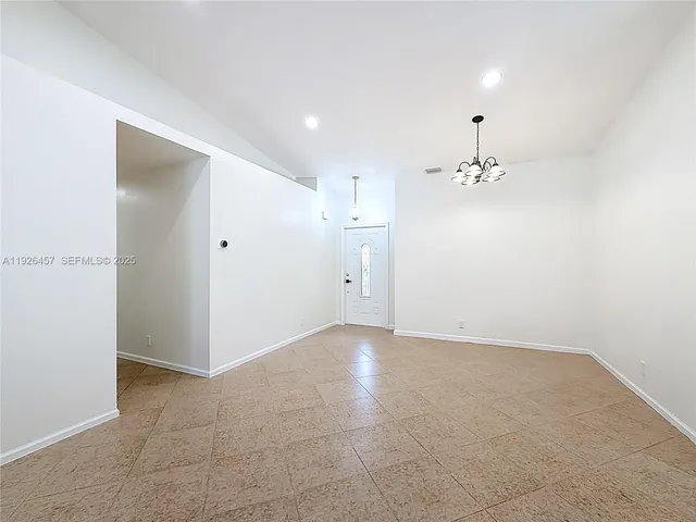 an empty room with a bathroom