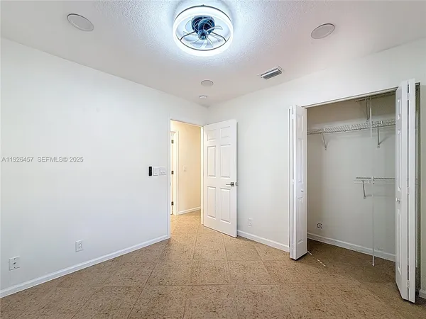 a view of a hallway to a room