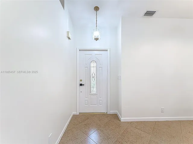 a view of a hallway with closet