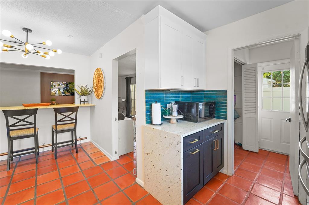 7523 Barry Road Tampa, FL 33634 - Photo 14 of 28 a kitchen with stainless steel appliances granite countertop a sink and cabinets