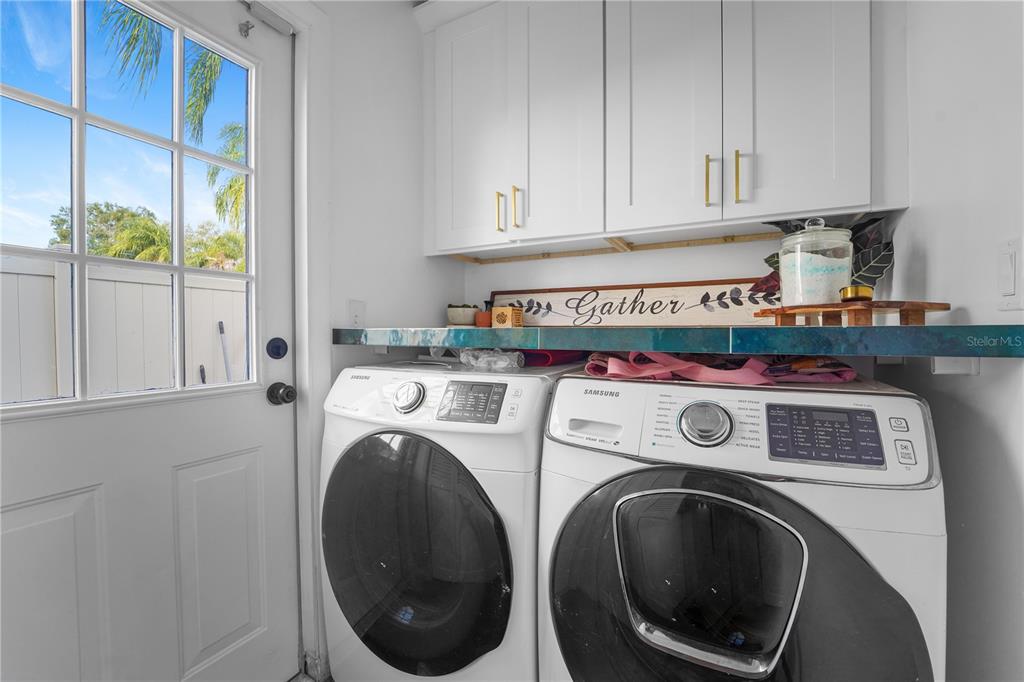 7523 Barry Road Tampa, FL 33634 - Photo 25 of 28 a utility room with dryer and washer