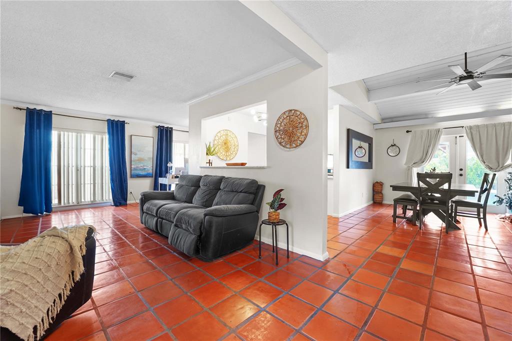 7523 Barry Road Tampa, FL 33634 - Photo 6 of 28 a living room with furniture and a large window