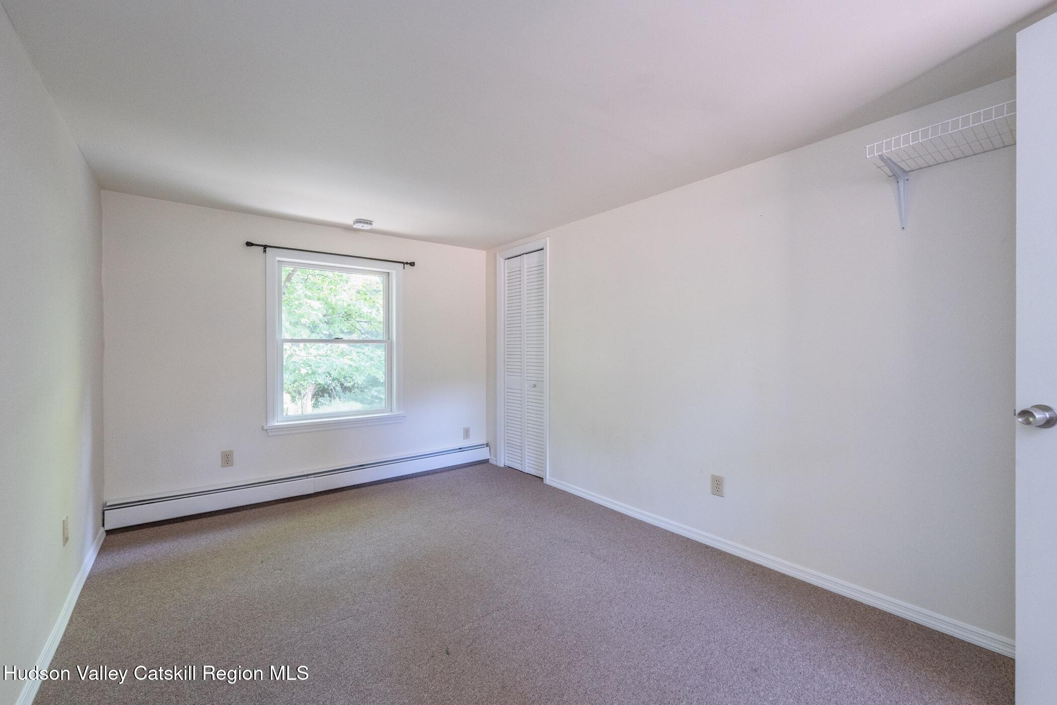 4533 Atwood Road Stone Ridge, NY 12484 - Photo 41 of 63 an empty room with a window