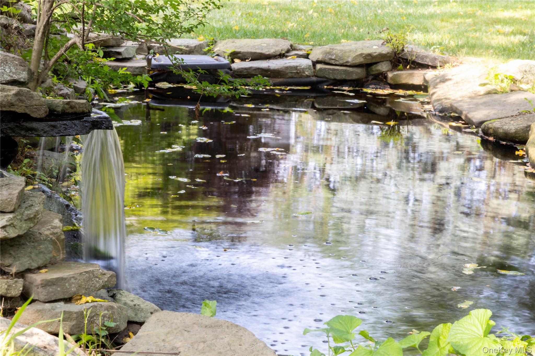 365 Rachels Road Mattituck, NY 11952 - Photo 24 of 26 Koi pond with waterfall