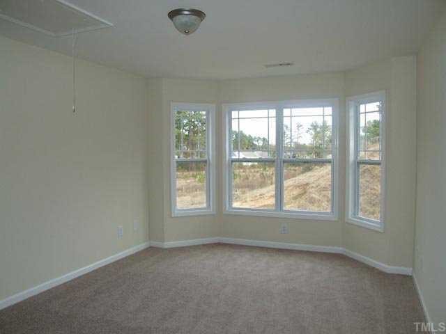 2215 Stoney Spring Drive Raleigh, NC 27610 - Photo 11 of 12 an empty room with a window