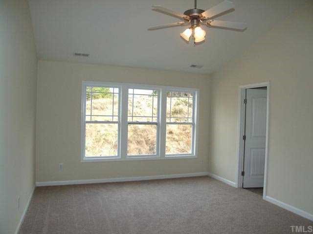 2215 Stoney Spring Drive Raleigh, NC 27610 - Photo 7 of 12 a view of an empty room with a window