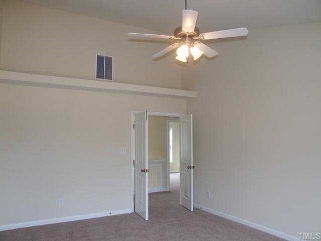 2215 Stoney Spring Drive Raleigh, NC 27610 - Photo 8 of 12 a view of a livingroom with a chandelier fan