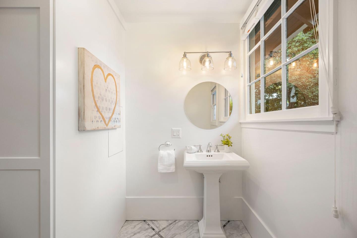 445 Arlington Road Redwood City, CA 94062 - Photo 15 of 50 a bathroom with a sink mirror and toilet