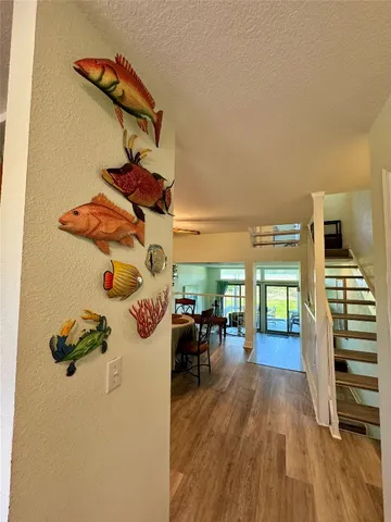 an entryway of a house with wooden floor