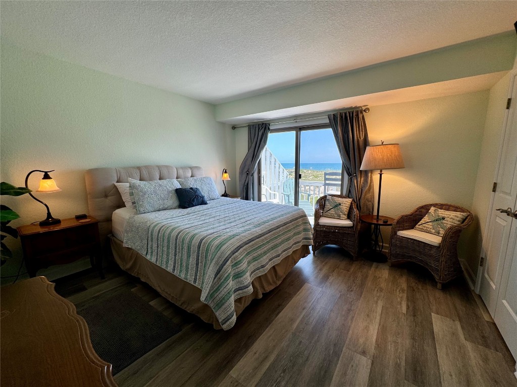 95118 Sandpiper Loop Fernandina Beach, FL 32034 - Photo 14 of 35 a bedroom with a bed and wooden floor