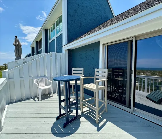 a view of a dinning tables and chairs in patio