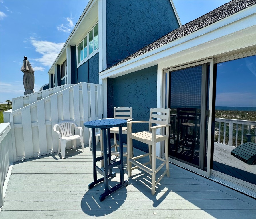 95118 Sandpiper Loop Fernandina Beach, FL 32034 - Photo 17 of 35 a view of a dinning tables and chairs in patio