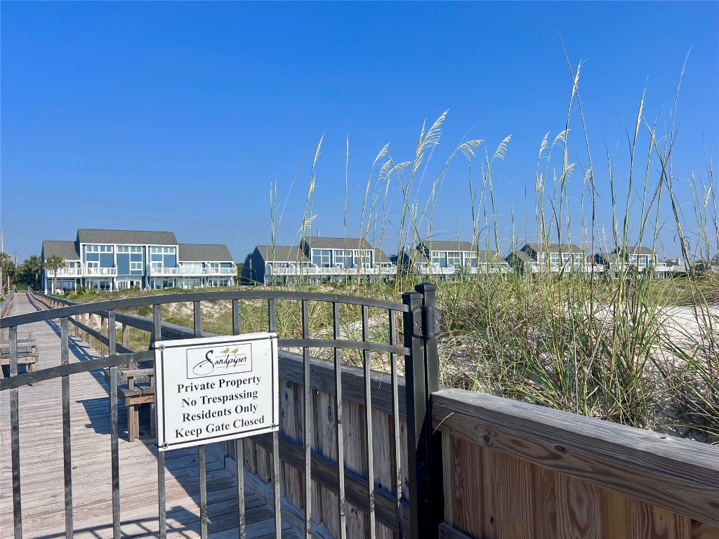 95118 Sandpiper Loop Fernandina Beach, FL 32034 - Photo 32 of 35 a view of a street with wooden benches