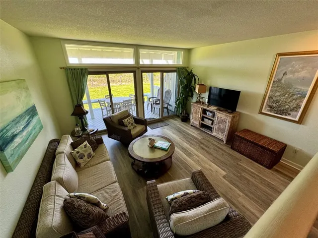 a room with furniture and a large window