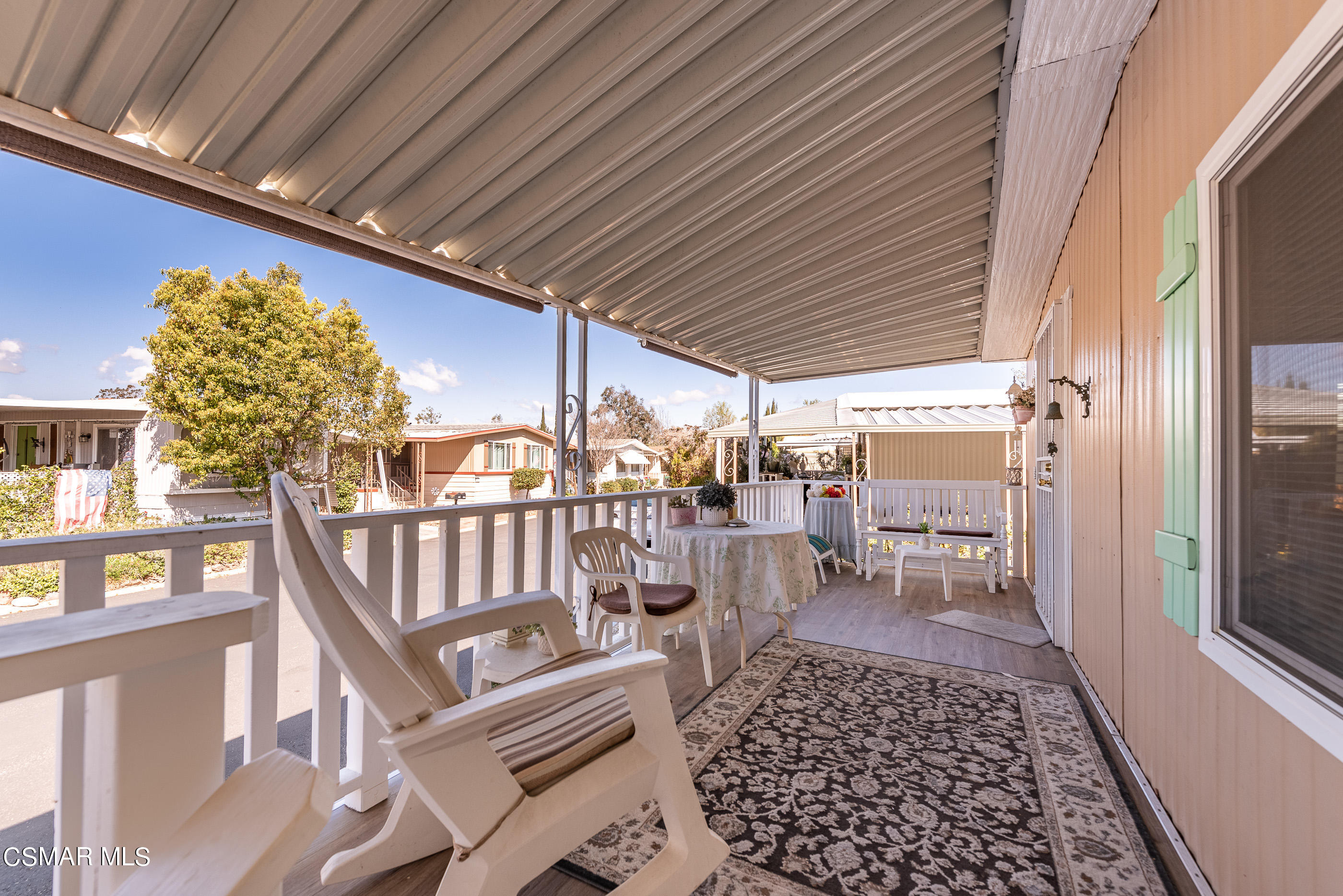 6480 Katherine Road, Unit 114 Simi Valley, CA 93063 - Photo 3 of 25 a balcony with chairs and outdoor space