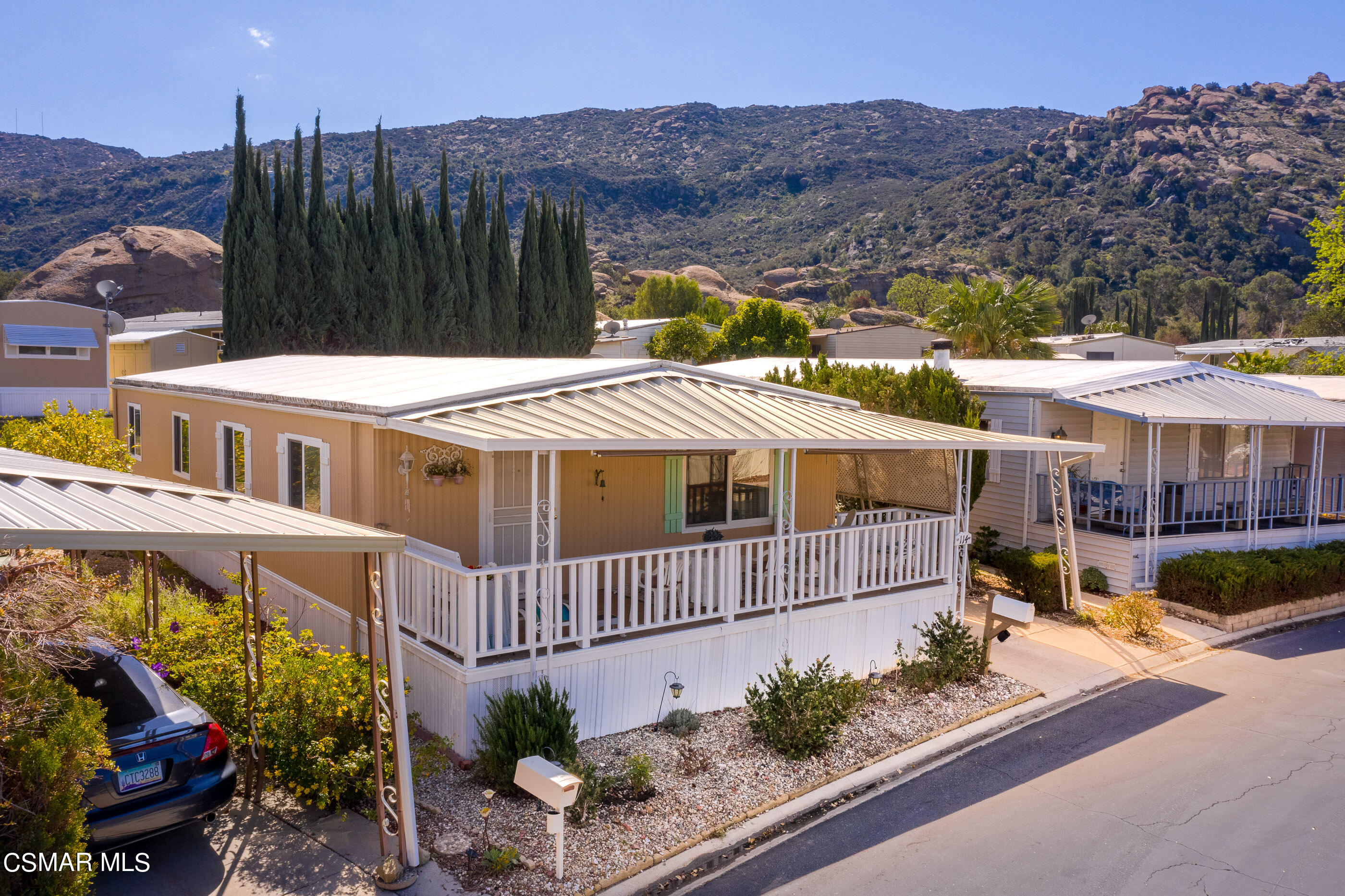 6480 Katherine Road, Unit 114 Simi Valley, CA 93063 - Photo 23 of 25 aerial view of a house with a yard and potted plants