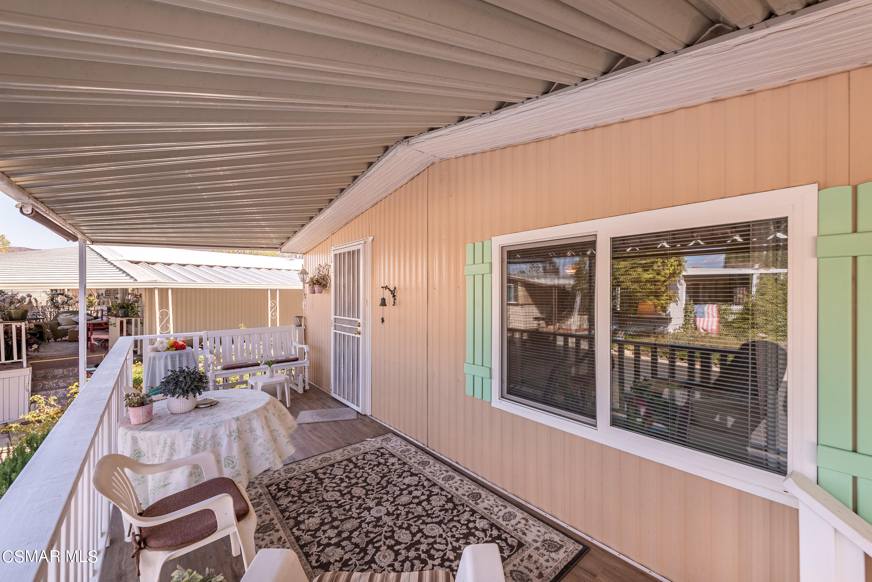6480 Katherine Road, Unit 114 Simi Valley, CA 93063 - Photo 4 of 25 a balcony view with a couch