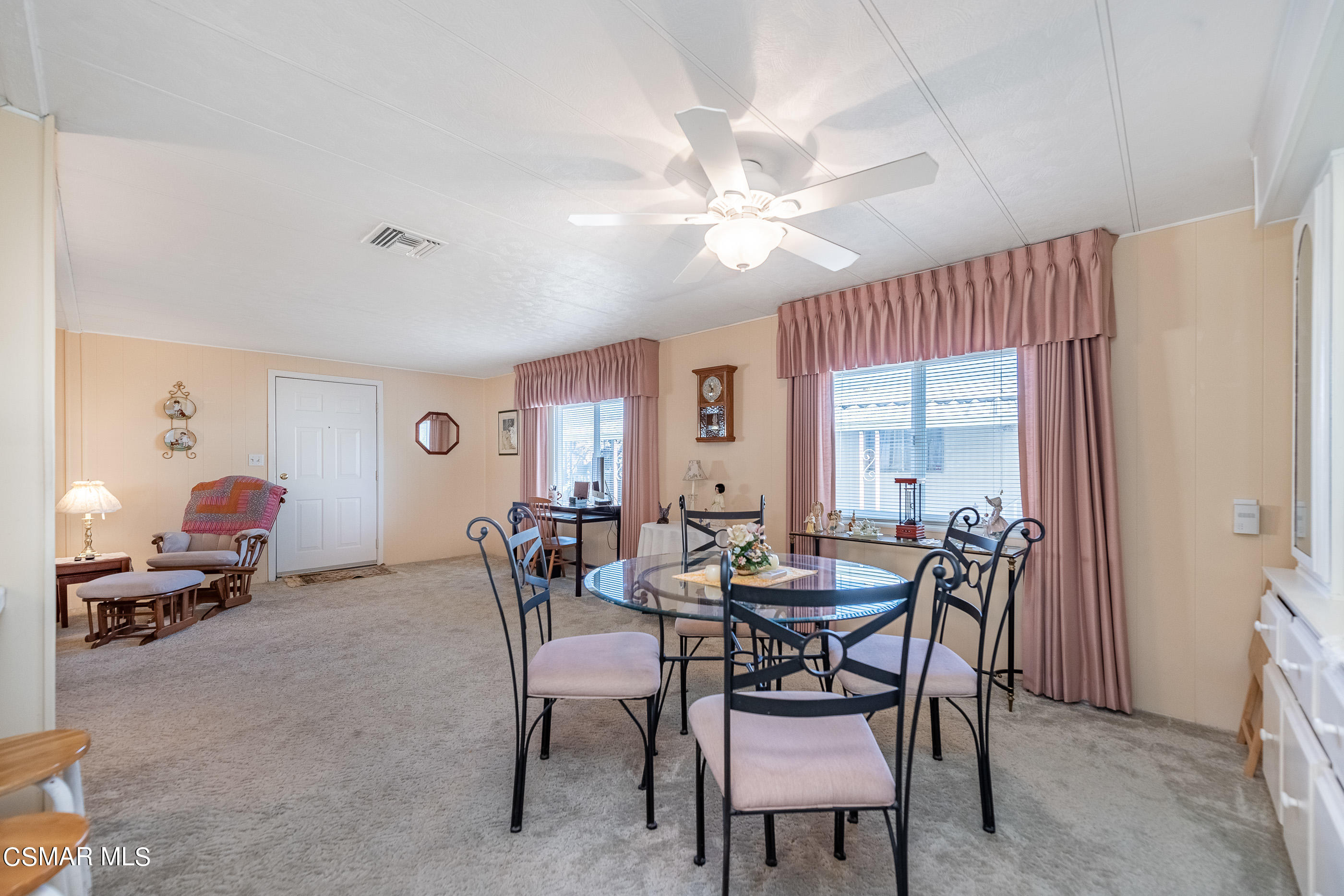 6480 Katherine Road, Unit 114 Simi Valley, CA 93063 - Photo 9 of 25 a view of a dining room with furniture and chandelier