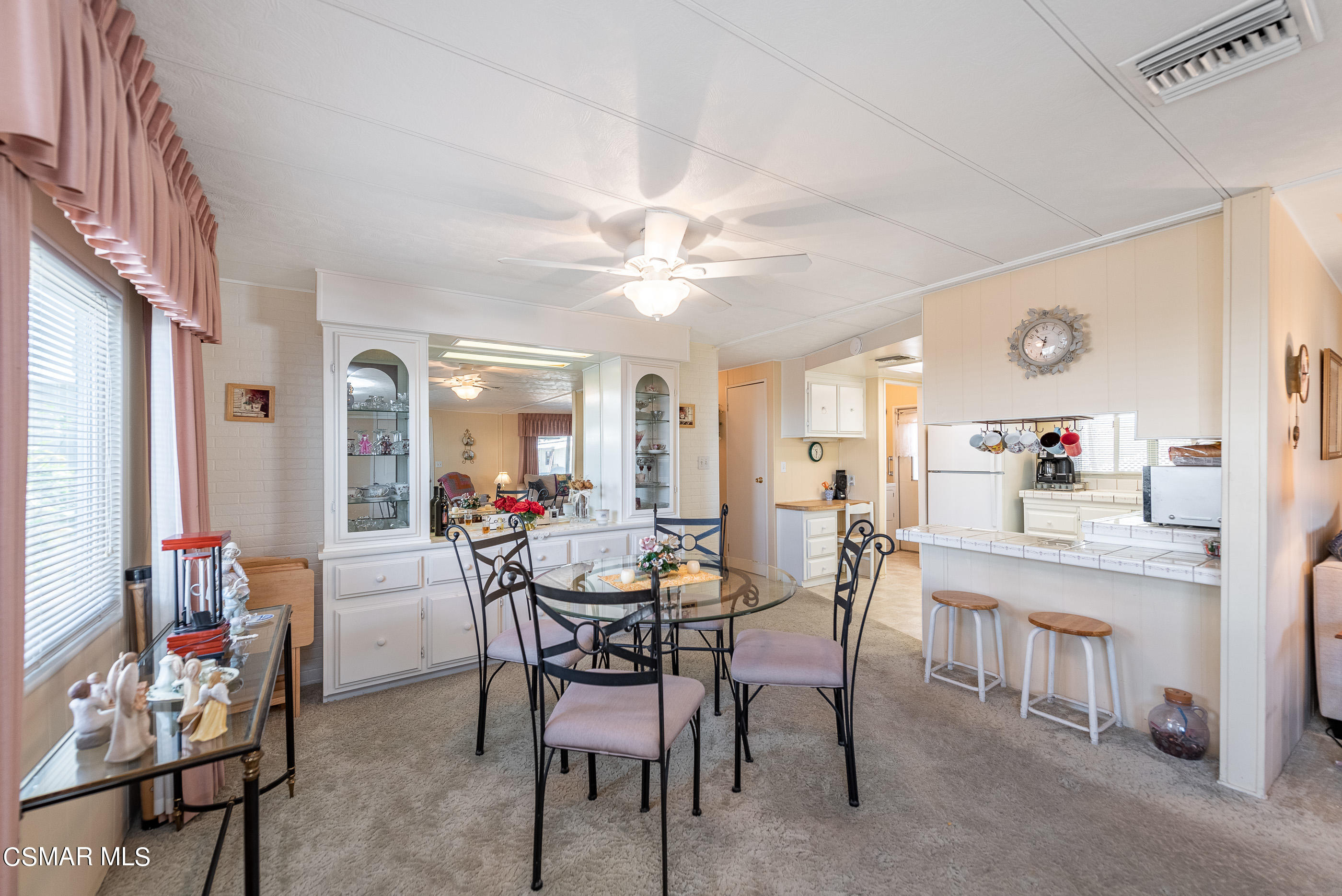 6480 Katherine Road, Unit 114 Simi Valley, CA 93063 - Photo 10 of 25 a view of a dining room with furniture and chandelier