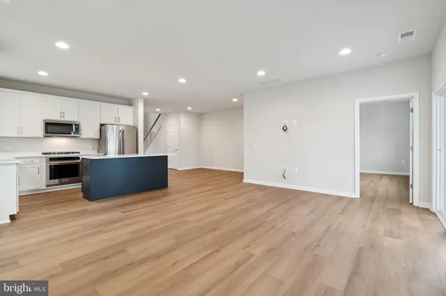 a view of kitchen with wooden floor