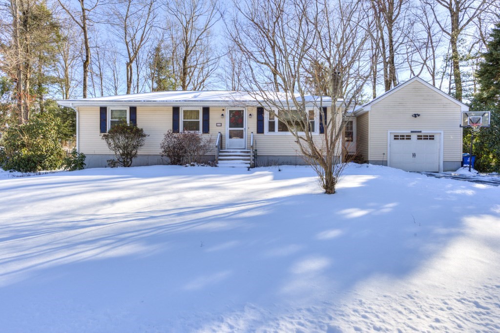 13 Anthony Drive Rutland, MA 01543 - Photo 1 of 40 a front view of a house with a yard and garage