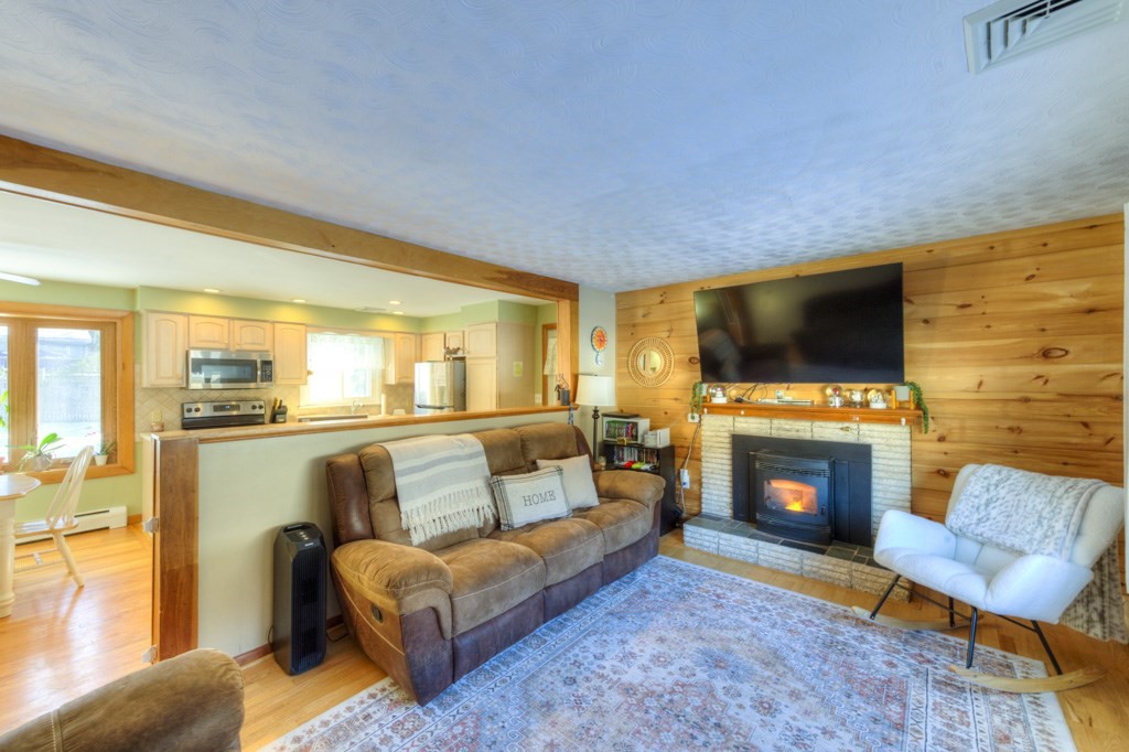 13 Anthony Drive Rutland, MA 01543 - Photo 13 of 40 a living room with fireplace furniture and a flat screen tv