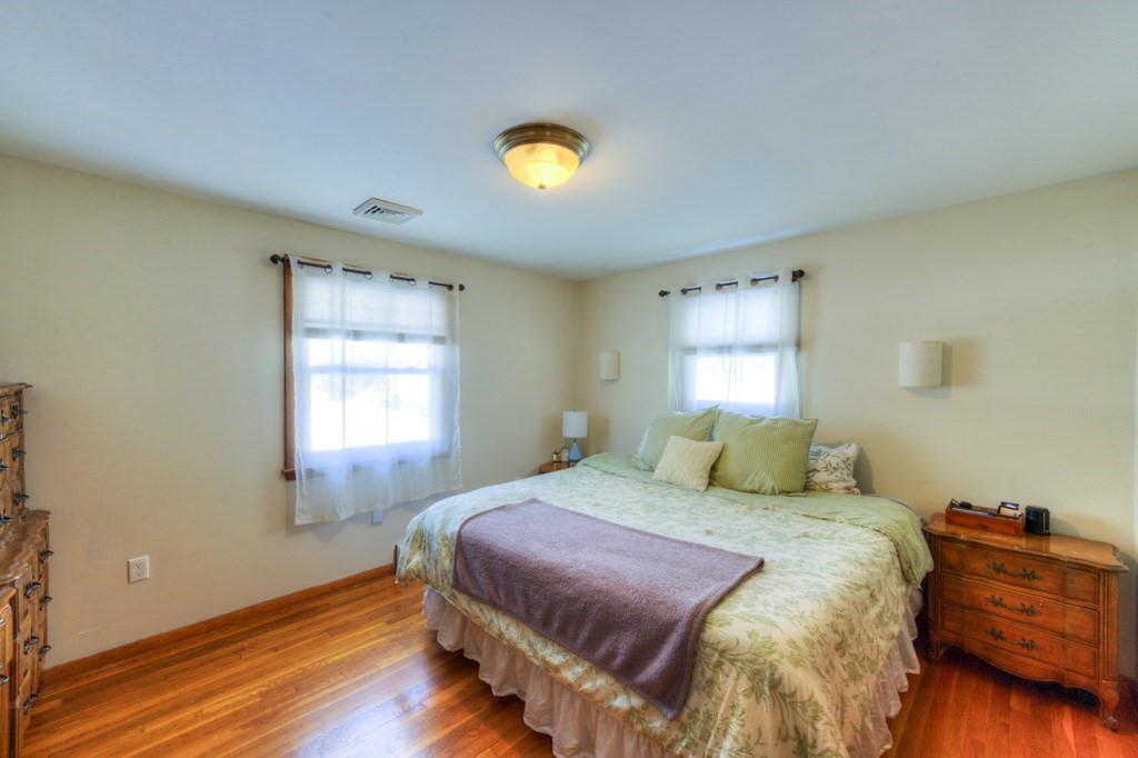 13 Anthony Drive Rutland, MA 01543 - Photo 17 of 40 a bedroom with a bed and a dresser next to a window