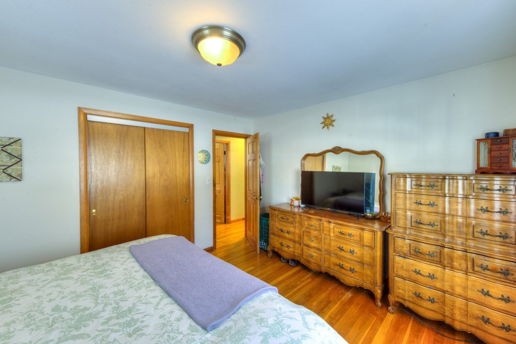 13 Anthony Drive Rutland, MA 01543 - Photo 19 of 40 a bedroom with a bed and flat screen tv