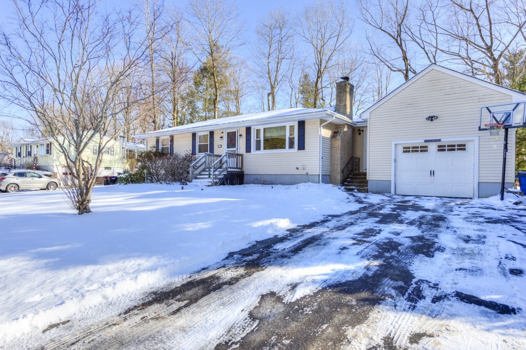 13 Anthony Drive Rutland, MA 01543 - Photo 2 of 40 a front view of a house with a yard covered with snow in front of house