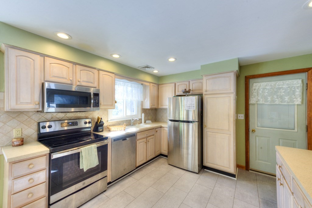 13 Anthony Drive Rutland, MA 01543 - Photo 5 of 40 a kitchen with stainless steel appliances a refrigerator stove and microwave