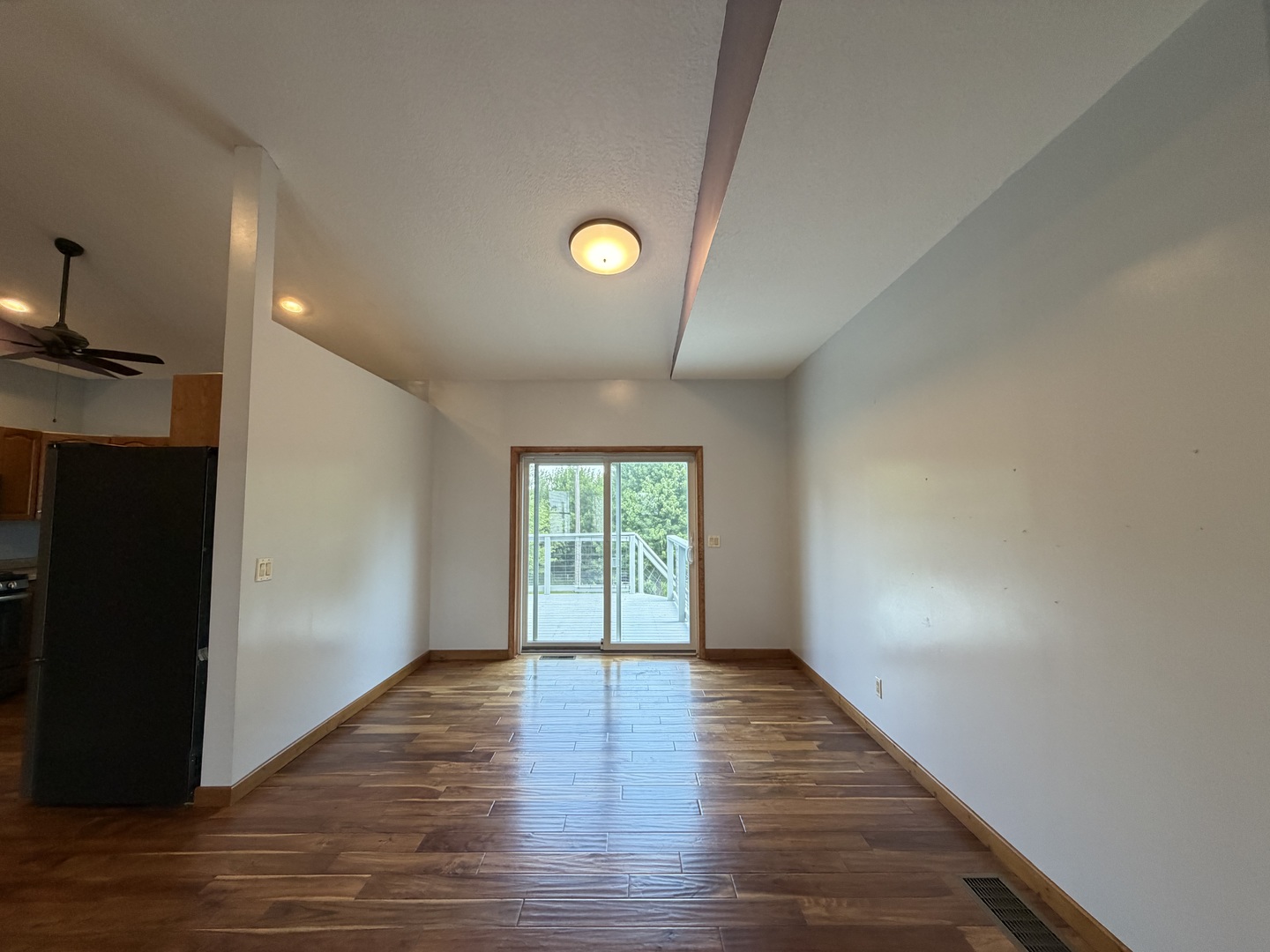 18760 Hillside Road Morrison, IL 61270 - Photo 11 of 36 a view of an empty room with wooden floor and a window