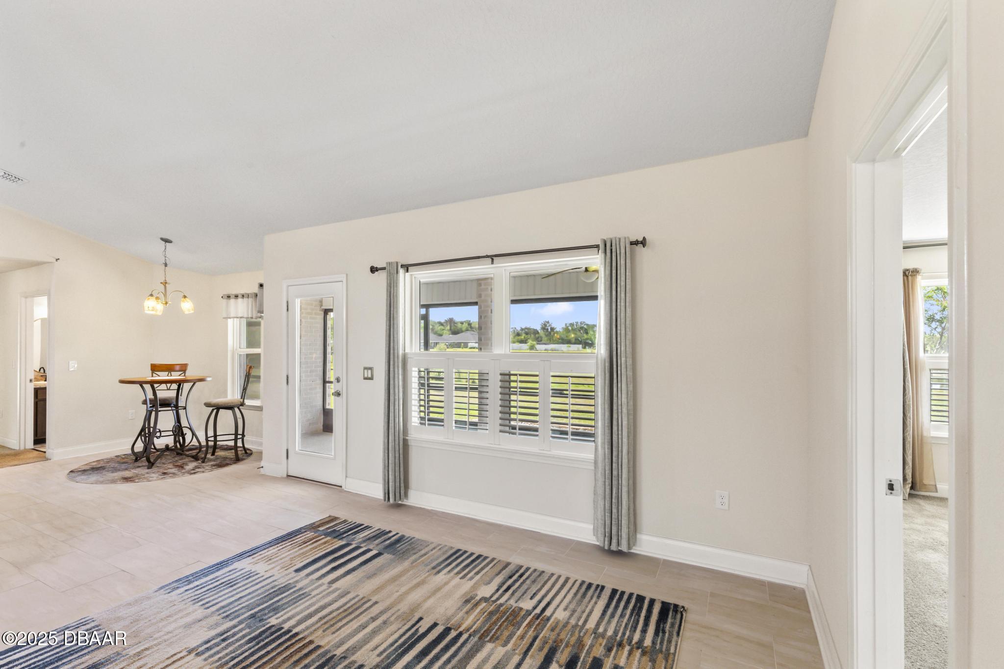 66 Eagle Lake Drive Flagler Beach, FL 32136 - Photo 16 of 77 a view of a room with furniture and a window