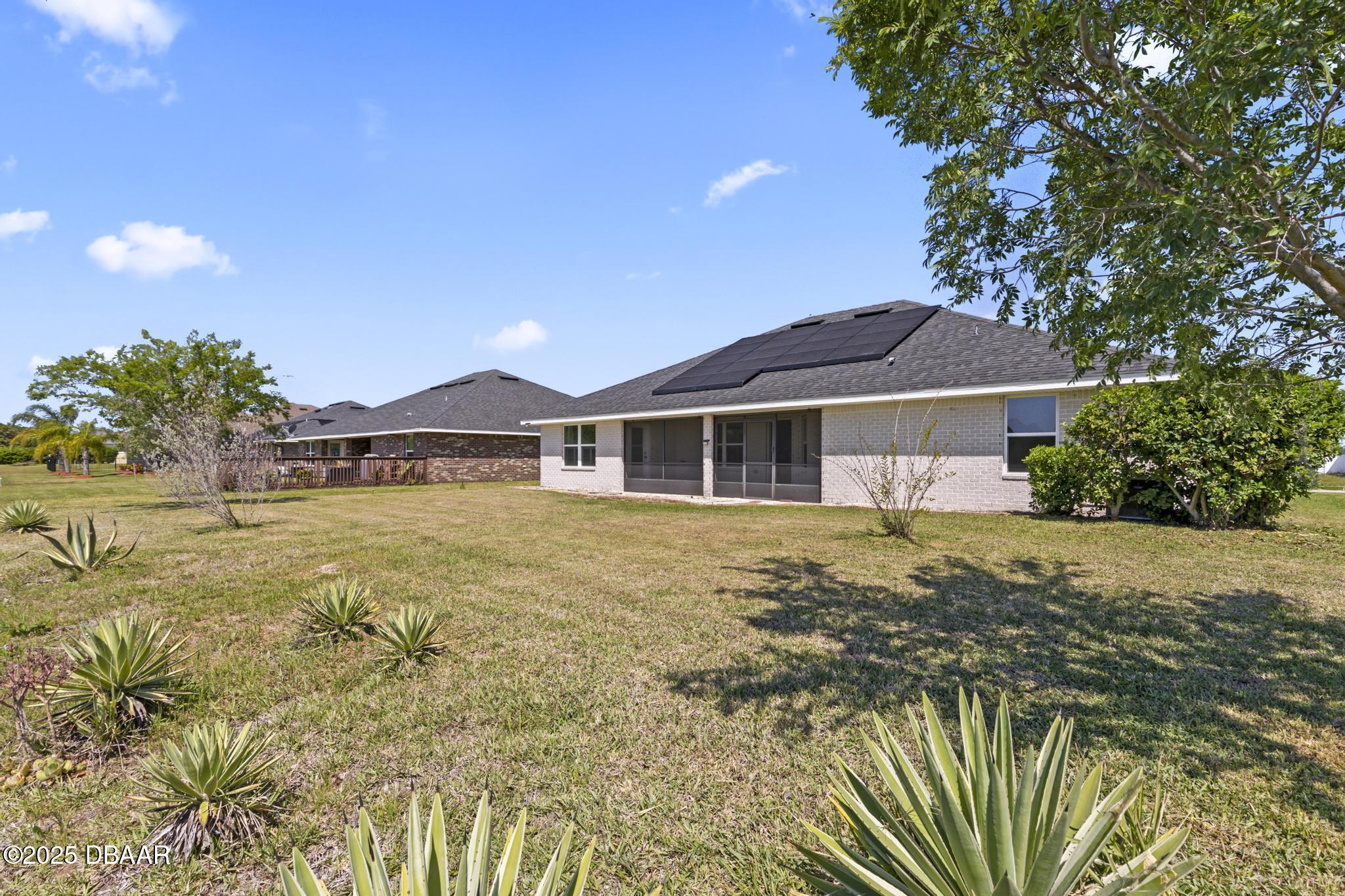 66 Eagle Lake Drive Flagler Beach, FL 32136 - Photo 48 of 77 a house with swimming pool in front of it