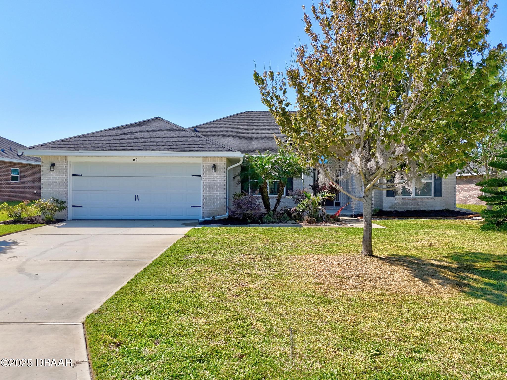 66 Eagle Lake Drive Flagler Beach, FL 32136 - Photo 51 of 77 a house view with a garden space